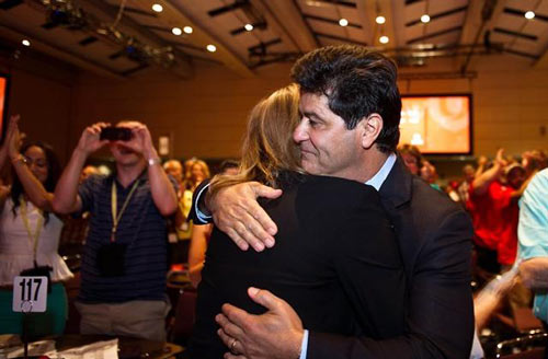 Jerry Dias hugs his wife Leslie after being declared the first president of Unifor at the Unifor founding convention in Toronto, Saturday, August 31, 2013. Dias, assistant to CAW national president Ken Lewenza, was chosen Saturday at the founding convention of Unifor, a merger of the CAW and the Communications, Energy and Paperworkers Union of Canada. 