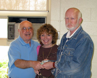 Norm Collins & Roz Monchamp with the 50/50 winner Ron Heffell