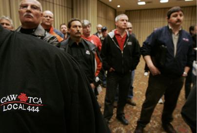 Members of the Canadian Auto Workers union listen at a news conference in Toronto, March 27, 2009. Union president Ken Lewenza said Chrysler and trhe CAW union are still far apart in negotiations to ...