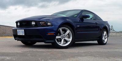 The 2010 Mustang gets an upgraded interior, tweaked styling, improved suspension and more power.