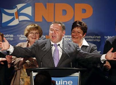 Nova Scotia NDP Leader Darrell Dexter celebrates with supporters in Dartmouth, N.S., after historic election win. 
