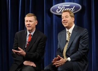 Alan Mulally, CEO of Ford, left, and Executive Chairman Bill Ford address the news media Thursday after Ford's annual shareholders meeting in Wilmington, Del. Mulally said that he expects the company's performance to improve through 2011 as the economy recovers. (BRADLEY C. BOWER/Bloomberg News)
