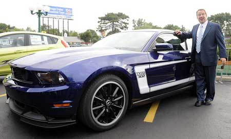 Bill Ford Jr. shows off a new 2011 Boss 302 Mustang at the Woodward Dream Cruise. Despite the challenges, he says, "I wouldn't change places with anybody in this industry today." Hybrids and electric vehicles "will become a core competency," he says. (Charles V. Tines / The Detroit News)