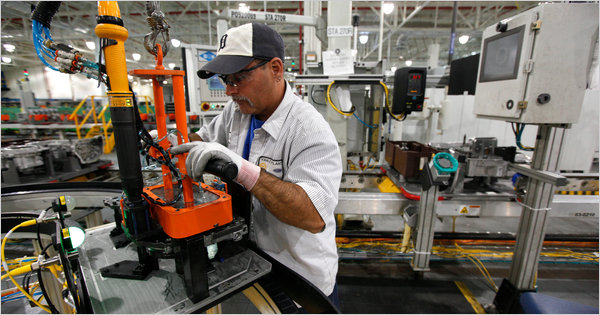 A worker assembles a transmission at a Ford plant in Sterling Heights, Mich.. Ford had its best third quarter in more than 20 years