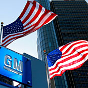Flags fly outside the headquarters building of General Motors in Detroit, Michigan, on June 1, 2010. (Photo: Jeff Kowalsky / Bloomberg via Getty Images)