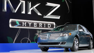 A Lincoln MKZ Hybrid is unveiled earlier this year at the New York International Auto Show in New York. Ford Motor Co. will soon have a first in the U.S. auto market: a hybrid sedan that costs the same as the gas-powered version. David Goldman/AP