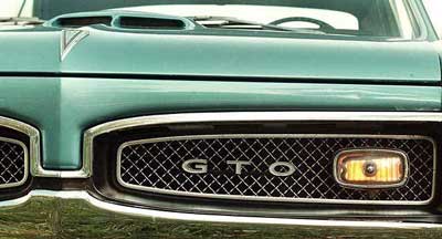 The hood ornament of a 1967 Pontiac GTO. Pontiac, whose GTO and Firebird muscle cars defined fast rides, drive-ins and cruising for a generation of teenage boys, is going out of business. (AP Photo/Journal Times, Mark Hertzberg, File)