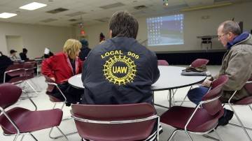 UAW members attend a meeting in December, 2008, in which they were given details about their imminent layoffs at a GM plant in Warren, Mich. 2008 Getty Images