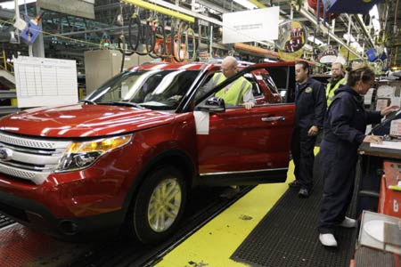 Plant employees assemble a 2011 Ford Explorer in December at Ford’s Chicago Assembly Plant. Sales for the new model have surpassed expectations, and some dealers report selling vehicles right off the truck. (M. Spencer Green / Associated Press)