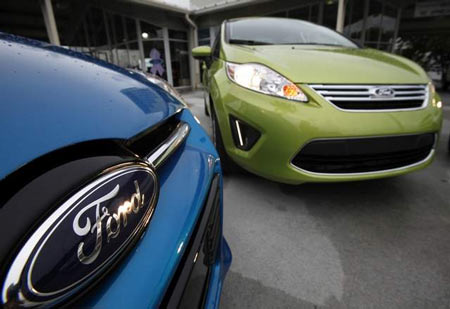 A 2012 Ford Focus and a 2012 Ford Fiesta at the Maroone Ford of Miami dealership in Miami. Smaller cars are on pace for a sales increase of more than 20 percent this year, Ford said today. (Wilfredo Lee / Associated Press)
