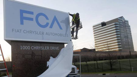 A new Fiat Chrysler Automobiles sign is unveiled at Chrysler Group World Headquarters in Auburn Hills, Mich., May 6, 2014.