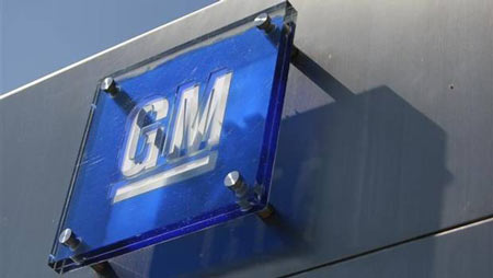 The General Motors logo is seen outside its headquarters at the Renaissance Center in Detroit in this file photo.
