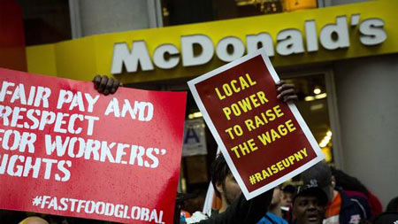 Demonstrators gather outside a McDonald's restaurant in New York, May 15, 2014.