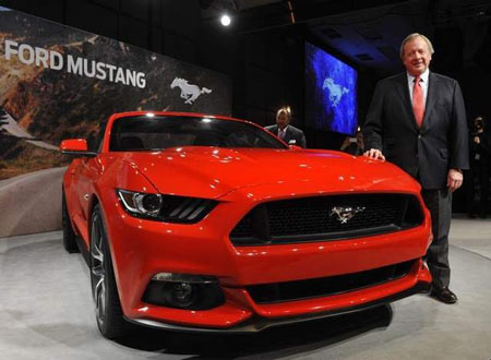 Edsel Ford II, the great-grandson of Henry Ford and a member of the board of directors of Ford Motor Co., poses with the all new 2015 Ford Mustang. (Charles V. Tines / The Detroit News)