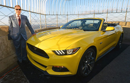 Ford Executive Chairman Bill Ford Jr. stands on top of the observation deck at the Empire State Building with the new 2015 Mustang convertible in honor of the car's 50th anniversary on Wednesday, April 16, 2014, in New York City. Getting the car to the 86th floor was some feat. (Ford Motor Co.)
