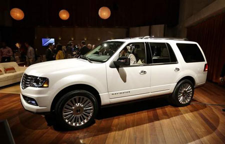 The 2015 Lincoln Navigator, a full-size SUV, is unveiled at the Detroit Auto Show. It will get a mid-cycle makeover and debut in the fall. The Navigator is the luxury brand's most expensive offering. (Carlos Osorio / AP)
