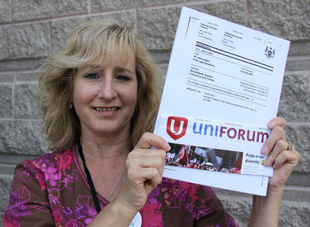 Cathy Wiebenga, former union plant chairperson Navistar workers, displays a copy of the Ontario Financial Services Tribunal ruling ordering Navistar to provide an estimated $28 million for retirees impacted by the closure of the Chatham truck assembly plant. Photo taken Monday, July 14, 2014 in Chatham, ON. ELLWOOD SHREVE/ THE CHATHAM DAILY NEWS/ QMI AGENCY