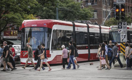 Two of the TTC's new streetcars officially entered service on the 510 Spadina route on Aug. 31. The vehicles are made at the Bombardier plant in Thunder Bay, where a strike has slowed production. 