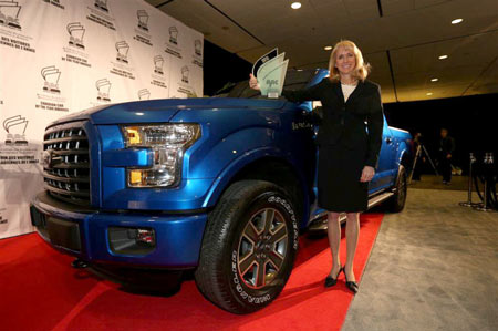 Dianne Craig, president and CEO of Ford Canada, receives the trophy after the Ford F-150 pickup was named the best Utility Vehicle of the year on Feb. 12