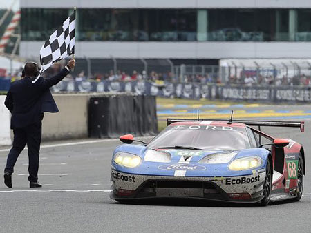 Germany's Dirk Mueller crosses the finish line on his Ford GT No. 68, to win the LMGTE PRO category of the 84th Le Mans 24-hours endurance race, on Sunday in Le Mans, western France. Photo Jean-sebastien Evrard / AFP/Getty Images