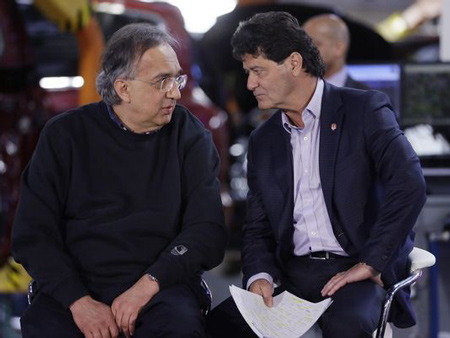 Sergio Marchionne, CEO of Fiat Chrysler Automobiles, left, talks with Unifor President Jerry Dias at the Windsor Assembly Plant, Friday, May 6, 2016 in Windsor, Ontario. Fiat Chrysler and Google announced Tuesday, May 3, that they will work together to more than double the size of Google's self-driving vehicle fleet by adding 100 Chrysler Pacifica minivans.