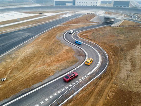 Vehicles drive on the newly-opened Nanjing Test Center, Ford’s first vehicle testing facility in China