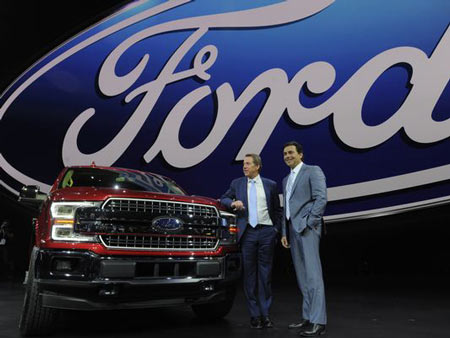 Executive Chairman Bill Ford and President Mark Fields pose next to the new F-150 Monday at the Detroit auto show.