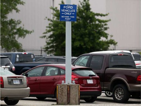A sign restricting Ford and non-Ford vehicle parking is posted at the automaker's Windsor Engine Plant on Henry Ford Centre Drive in Windsor on June 5, 2017. Jason Kryk / Windsor Star 