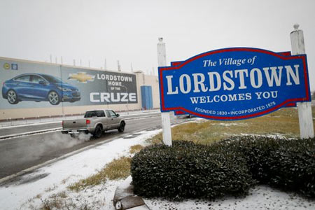 A banner depicting the Chevrolet Cruze is displayed at General Motors' Lordstown plant, Nov. 27, 2018, in Lordstown, Ohio. GM has targeted five plants for possible closure, including the plant in Lordstown.  (Photo: John Minchillo, AP)