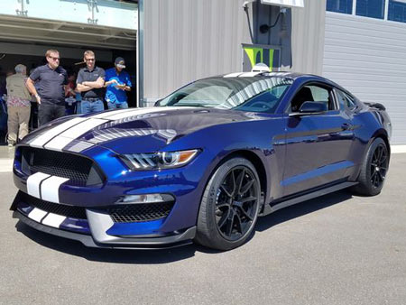 New for 2019, the Ford Mustang Shelby GT350 gets stickier Michelin tires, a new rear aerofoil, as well as comprehensive suspension upgrades. It all adds up to better performance to compete with Chevy's quick Camaro.(Photo: Henry Payne, The Detroit News)