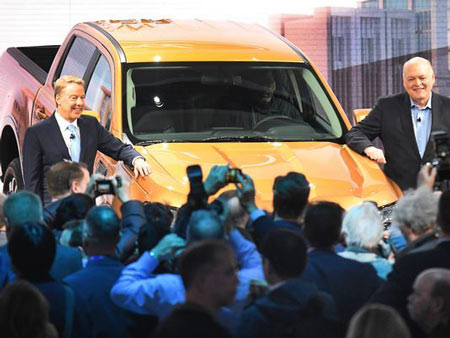 Ford Executive Chairman William Clay Ford Jr. and CEO Jim Hackett pose with the 2019 Ford Ranger truck at the auto show.