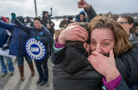 Amy Drennen, right, of Lordstown, Ohio, an employee at General Motors for 12 years, receives a hug from Pam Clark, as people gather in front of the General Motors assembly plant, Wednesday, March 6, 2019, in Lordstown, Ohio. Wednesday is the last day of the plant's Chevrolet Cruze production, a move that will eliminate nearly 1,700 hourly jobs and idle the plant. (Steph Chambers/Pittsburgh Post-Gazette via AP) (Photo: Steph Chambers / AP)
