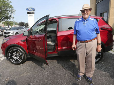 Hitting 100 and ready to hit the road with a fresh set of wheels. Windsor's Earl Wilson, 100, poses next to his new 2019 Ford Escape on July 8, 2019, at the Performance Ford dealership in Windsor. Dan Janisse / Windsor Star