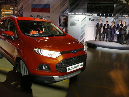 In this photo taken on Tuesday, Dec. 2, 2014, Russian Prime Minister Dmitry Medvedev, second right, attends the launch of Ford EcoSport production during a visit to Ford Sollers at a plant in Naberezhnye Chelny, about 450 miles east of Moscow. Ford said Wednesday March 27, 2019, that it will close three factories in Russia, causing heavy job losses, as it closes this vehicle assembly plants in Naberezhnye Chelny and pulls out of passenger vehicle manufacturing in the country. (Photo: Dmitry Astakhov / AP, file)