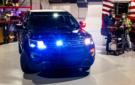 Flashing hazard and tail lights of Ford's Police Interceptor Utility vehicle warn officers that the high-temperature interior disinfecting process is running. The sanitation procedure seeks to limit the spread of COVID-19 to first responders. (Photo: Ford)