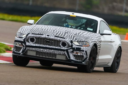 The 2021 Ford Mustang Mach 1, shown testing in camouflage, has signature air intakes in the grille.  (Photo: Wes Duenkel, Ford)