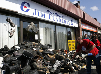 Hundreds of Canadian Auto Worker Union members gathered to present Finance Minister Jim Flaherty with thousands of old work boots collected from laid off workers from across Ontario. The CAW left the boots at Flaherty's Whitby-Oshawa riding office Oct. 6. 