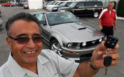 Retired Ford of Canada worker Vince Gucciardo purchased a Ford Mustang GT/CS from Knapp Ford. His 300-hp convertible is red and will arrive soon from a dealership in Ottawa.