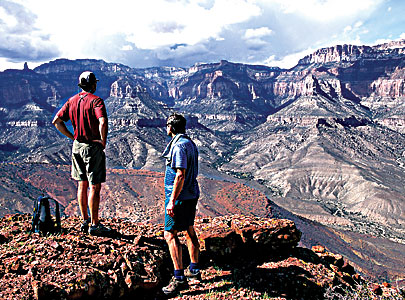 Hikers admire the view from Nankoweap Butte in the Grand Canyon National Park. Comparatively few visitors venture down to the bottom of the canyon, where other experiences await. 